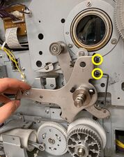 The two "fixing bolts" are marked. The bolts can be hard to access, sometimes it is easier when turning the pressure lever counter-clockwise.