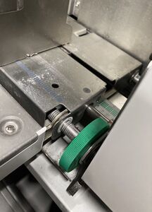 The green up/down positioning dial on the feed tray of a 3770—this one is set a little past the center position (resulting in the image being slightly lower on the page).