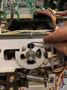 Using a 2mm hex wrench to loosen the set screw in the p-disc so that it may be rotated to a new position.