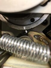 The current position of the cam pulley relative to the belt, marked in whiteout (for a fine adjustment).