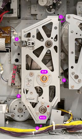 Tighten the screws in the order indicated in this image. (The separator spring should not have been installed yet, and is crossed out in this image.)