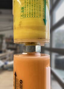 An empty Yellow recipient tube connected to a full Sunflower donor tube.