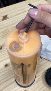 Removing the nozzle insert from an FII tube.
